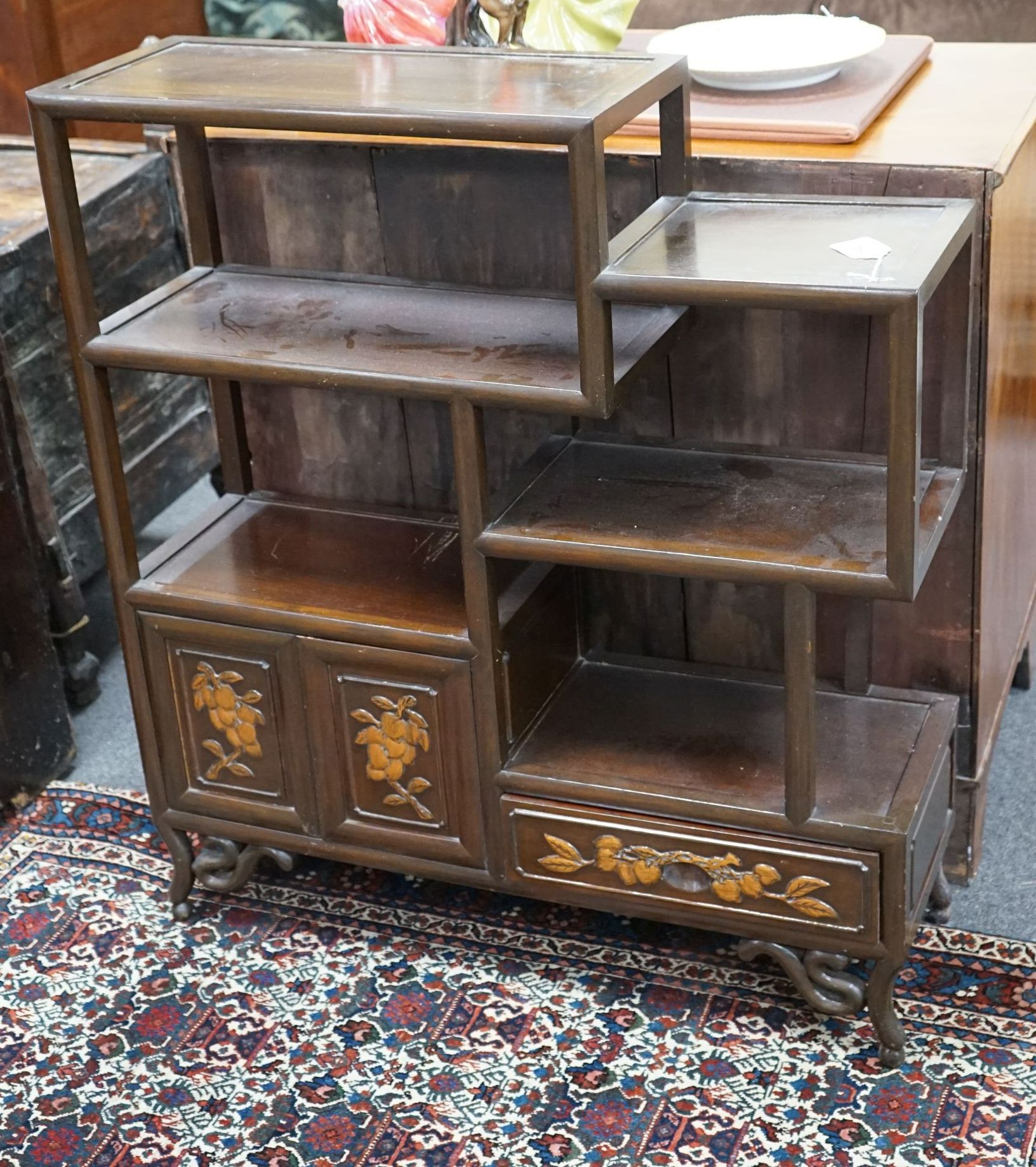 A Chinese elm tiered side cabinet, width 81cm, depth 26cm, height 91cm